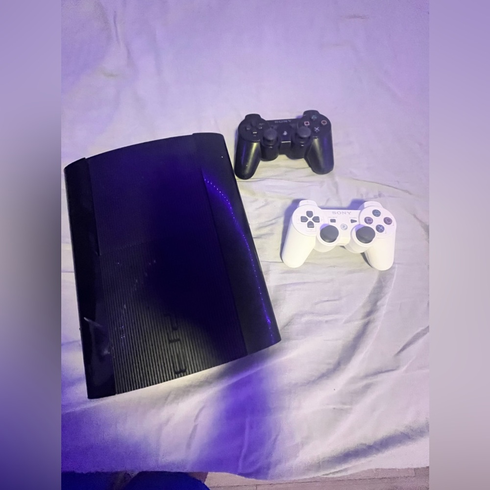PS3 with two controllers and black ops 2 inside